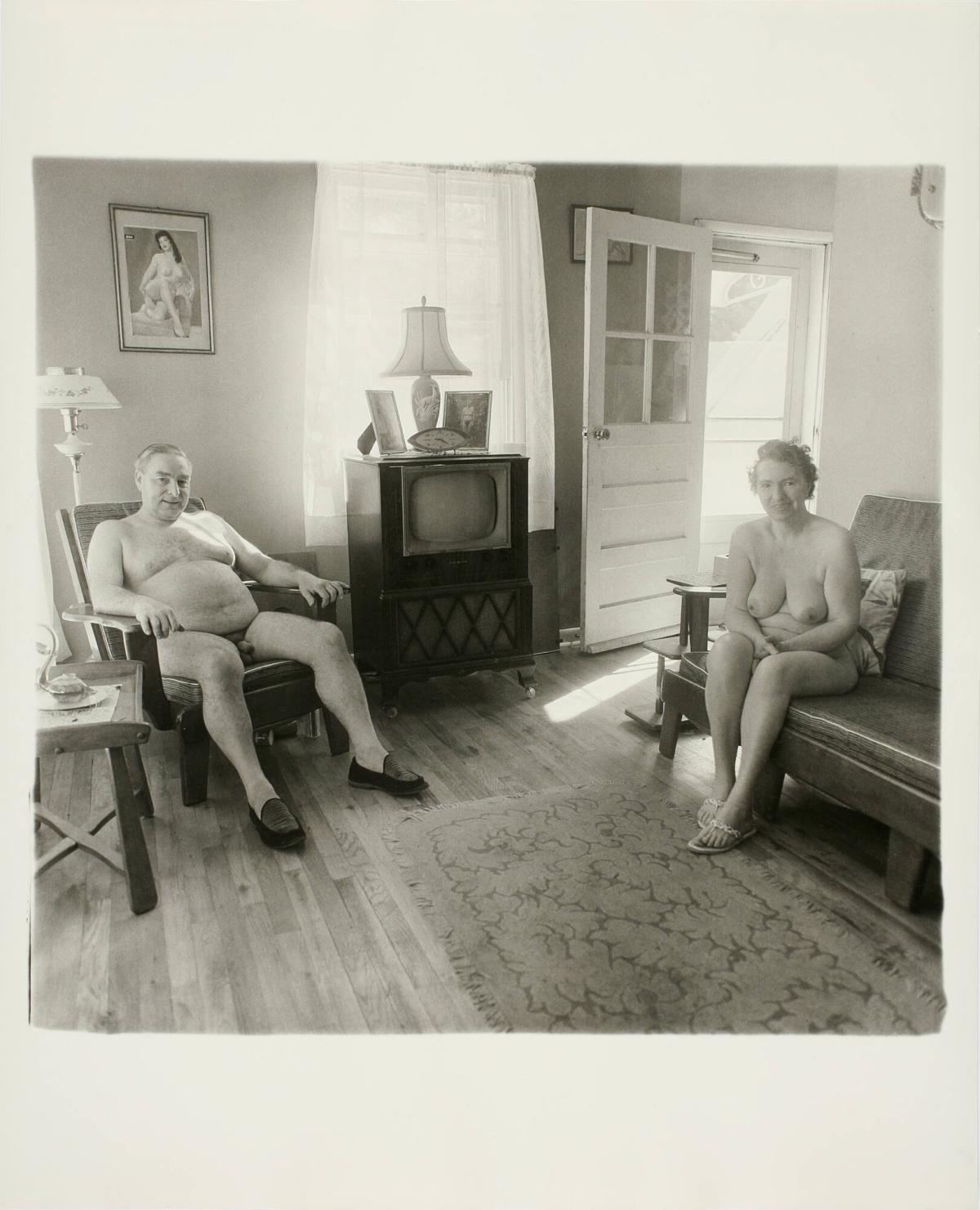 Retired Man and his Wife at Home in a Nudist Camp One Morning in N.J. On the Television Set are Framed Photographs of Each Other, from the portfolio A Box of Ten Photographs